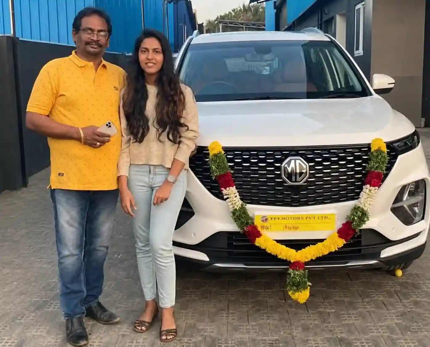 Car loan approved couple taking delivery of MG Hector in Madurai