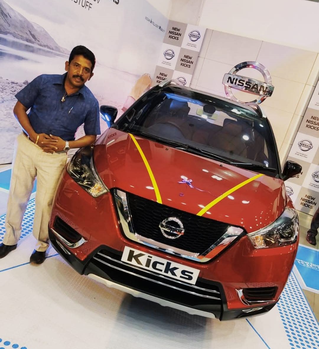 Customer celebrating new Nissan Kicks delivery via car loan in Tamil Nadu