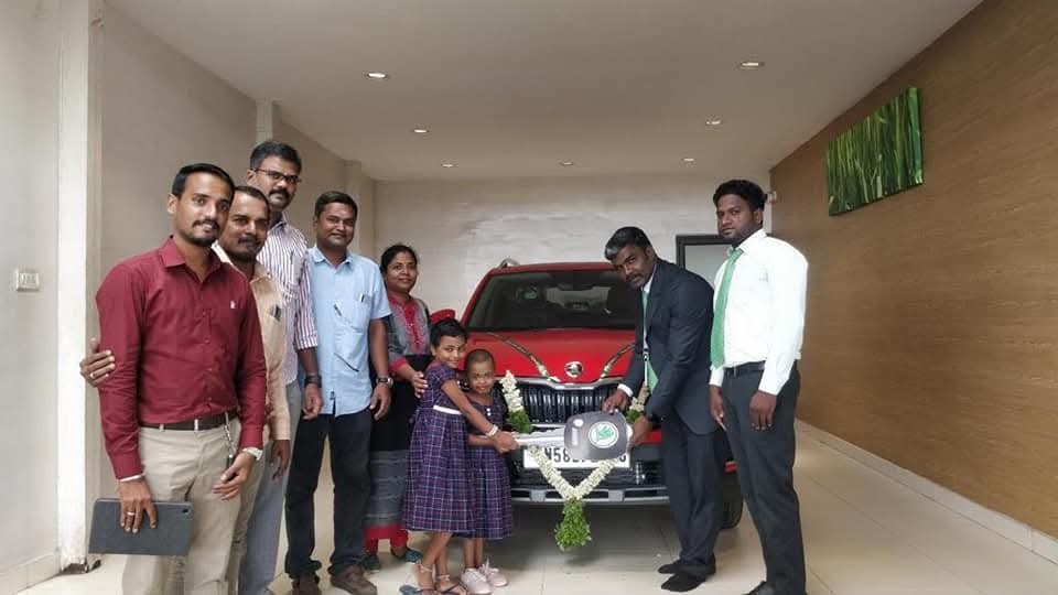 Happy Customer Receiving New Car Through Car Loan Madurai – Sakthi Associates